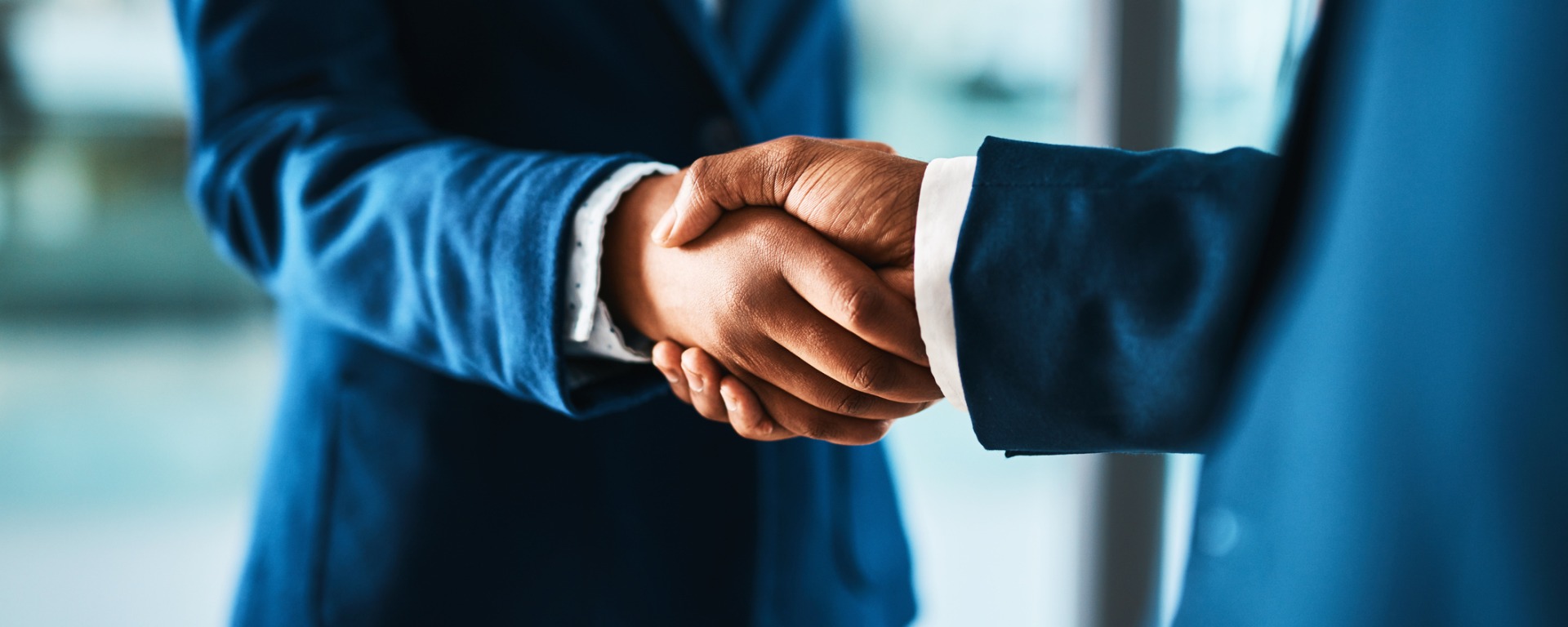Two businesspeople shaking hands